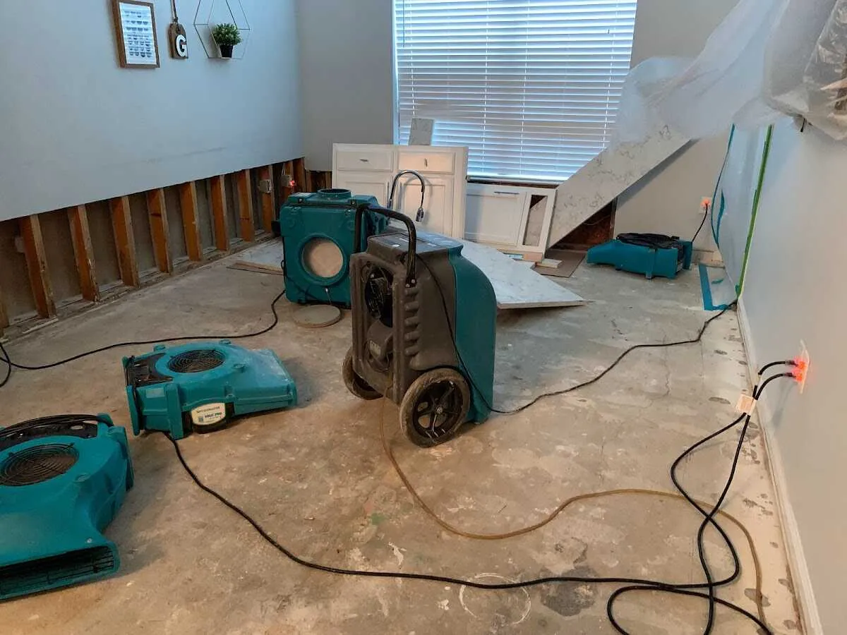 Dehumidifier in flood-cut room for Water Damage Restoration in Bondurant